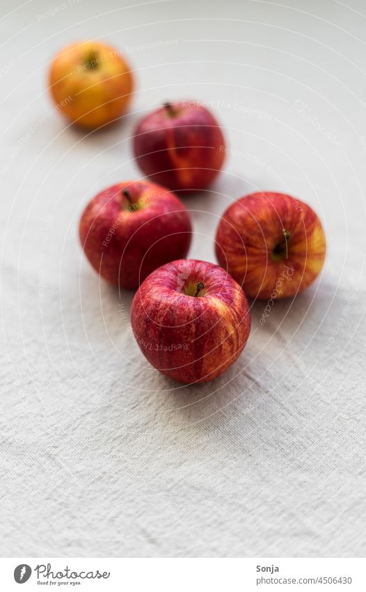 Close up of red apples on a linen tablecloth Apple Red Close-up cute Raw Fruit Healthy Food Fresh Nutrition Diet Organic Vegetarian diet Delicious Juicy