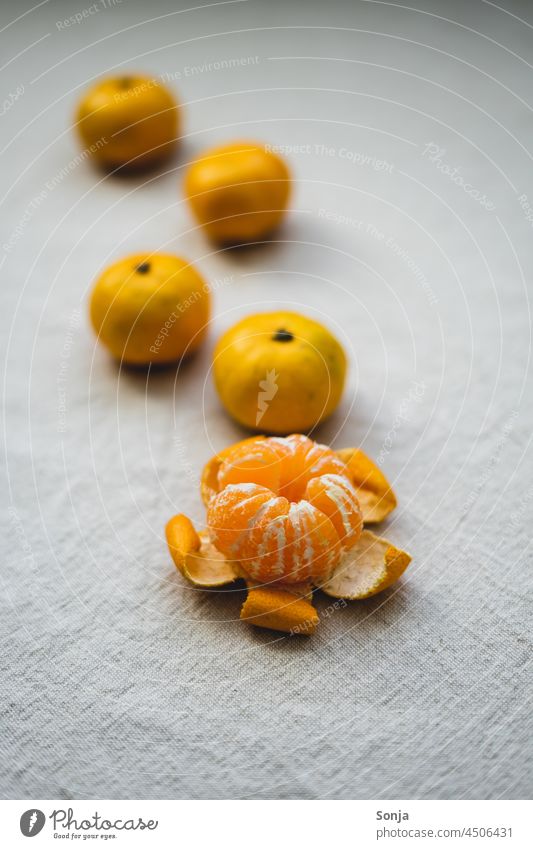 Close-up of a peeled tangerine on a beige linen tablecloth. Tangerine fruit Orange Colour photo Healthy Delicious cute Winter Vitamin Vitamin C Healthy Eating