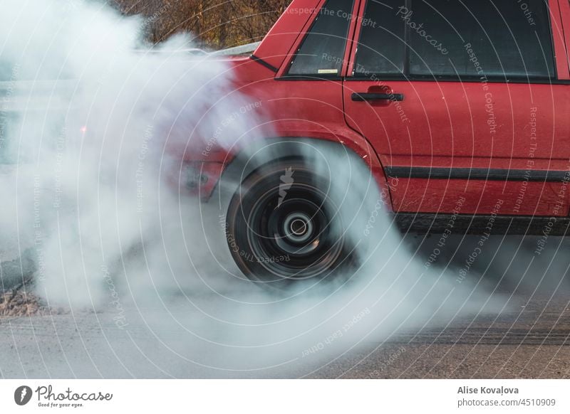burn the tires car burnout red car tire burning tire in motion Colour photo rubber motion of a tire wheel Car tire driving Vehicle smoke cloud of smoke
