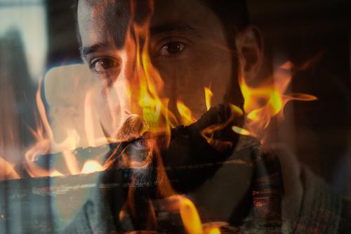 Double exposure: man face in fire Man Face Fire Double dressing Burn Blaze Flame bearded masculine incinerate sb./sth. Warmth Looking Looking into the camera