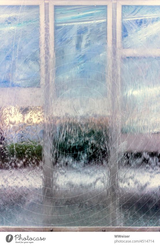 Abstract image of water running over transparent plastic or glass surface, in the background you can see schemes of a small town Waterfall overthrow sb./sth.