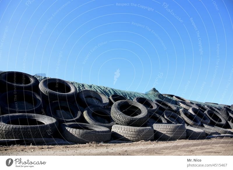 Silage cover with old car tires Farm Silo silage Car tire scrap tyres Blue sky Agriculture Feed agricultural land Covers (Construction) Cattle feed Heap Stack