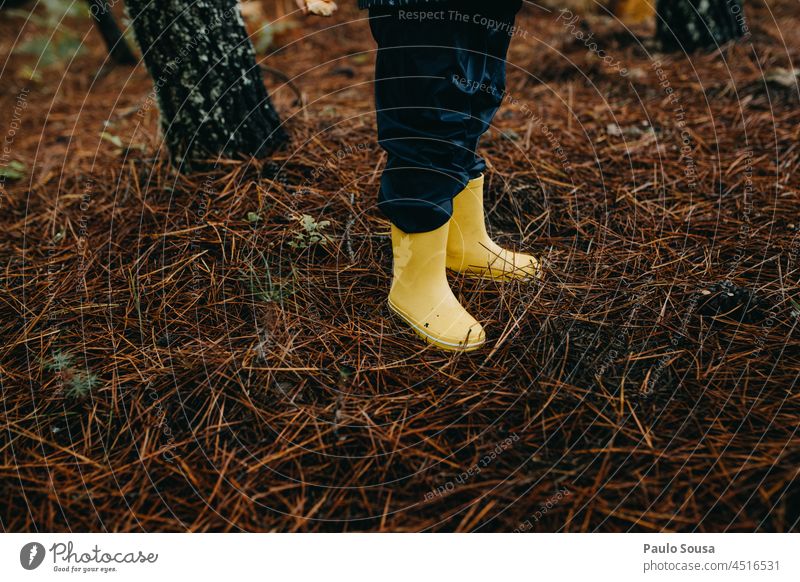 Close up Yellow rubber boots Rubber boots Rain Water Weather Exterior shot Joy Green Dirty Footwear Child Wet Boots Feet Day Multicoloured Autumn Playing Puddle