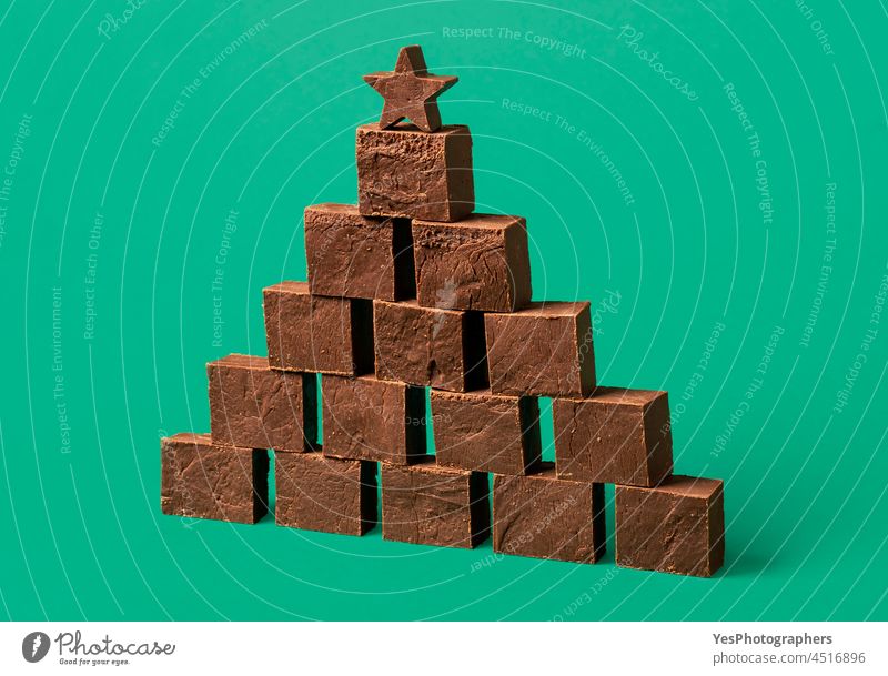 Chocolate fudge pile, on a green background. abundance bar brown brownie cacao cake chocolate christmas color confectionery cuisine dark delicious dessert food
