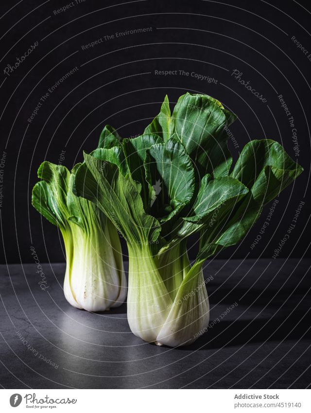 Chinese cabbages on black table in studio chinese cabbage vegetable bok choy pak choy food healthy leaf diet two healthy food vitamin fresh plant raw