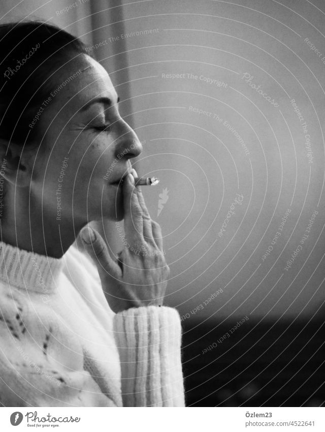Woman smoking with her eyes closed Smoking Smoky Smoker Cigarette Black & white photo Closed eyes enjoyment delightful portrait Adults Human being Feminine