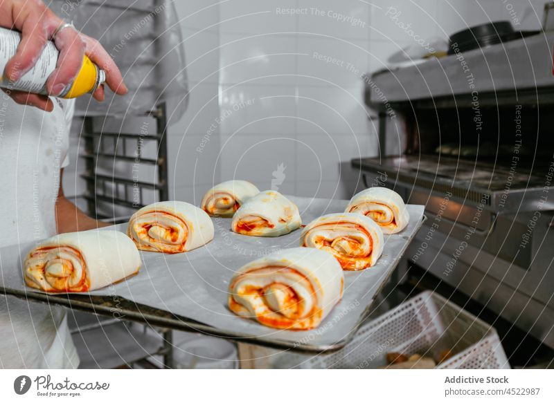 Baker preparing pastry in kitchen chef cook cuisine yummy prepare dessert process tasty fresh food tray delicious bakery culinary bakehouse baking pan cream