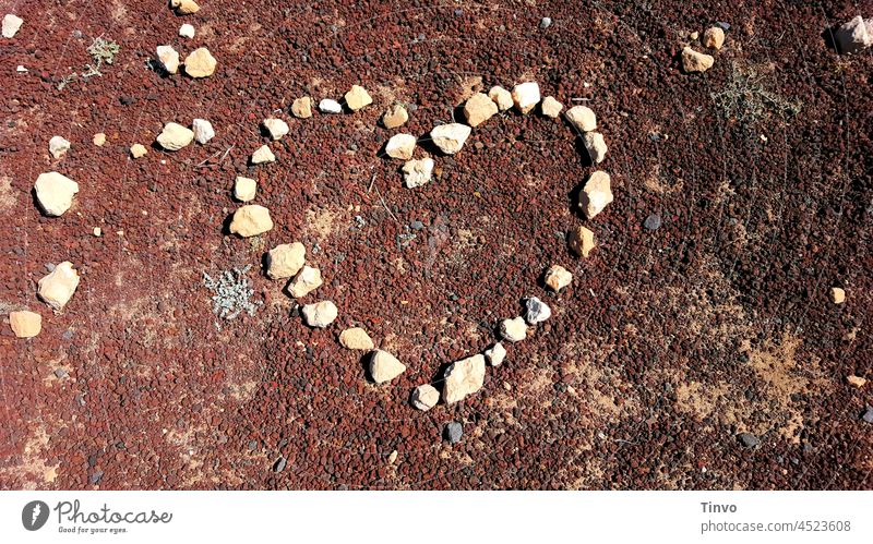Heart from stones formed on red lava Lava Lava granules Granulate Nature Heart-shaped Symbols and metaphors Romance Colour photo Sign Exterior shot Infatuation