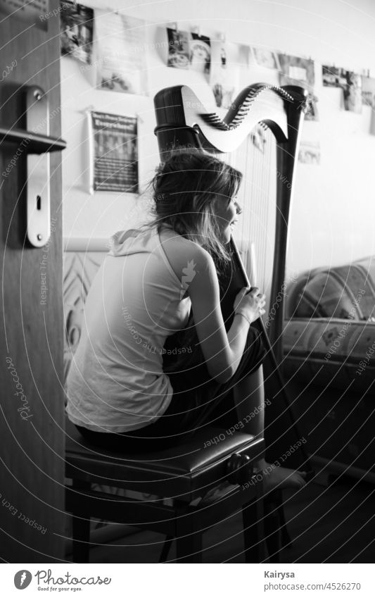Young lady playing the harp Happy girl Harp Music black and withe Black & white photo Close-up inspiring insulation autism nonverbal communication Body language