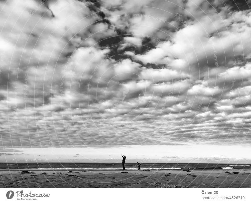 Father and son under wide sky on beach Beach Sky Clouds Ocean Human being Langeoog Exterior shot Island vacation travel Sand Nature Relaxation Father with child