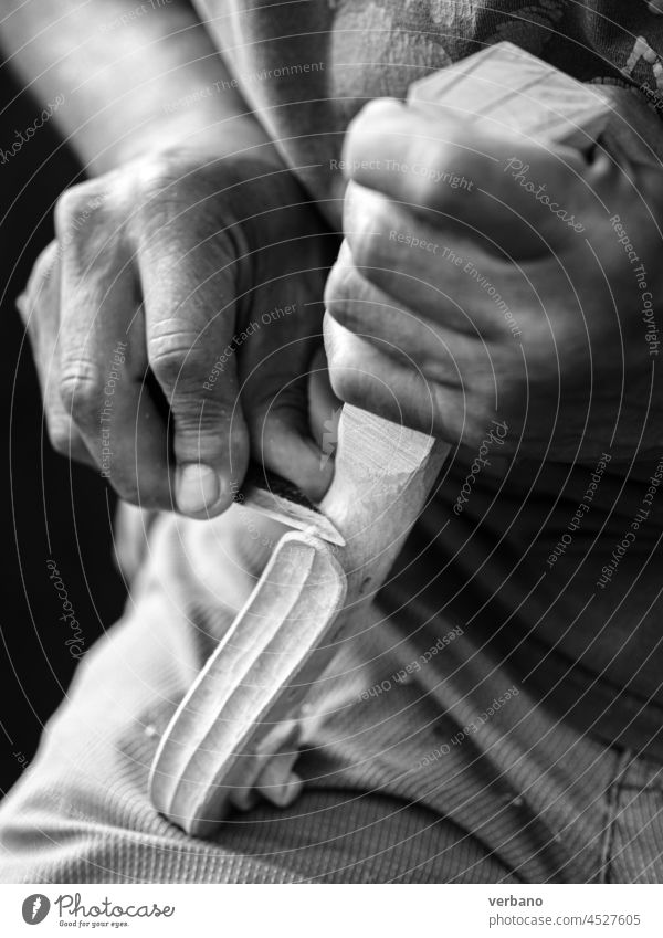 Violin maker who curves and sculpts a classical violin head Artisan Craftsman Luthier Capability Curl handcrafted woodwork Design Detail Concentrate Carving