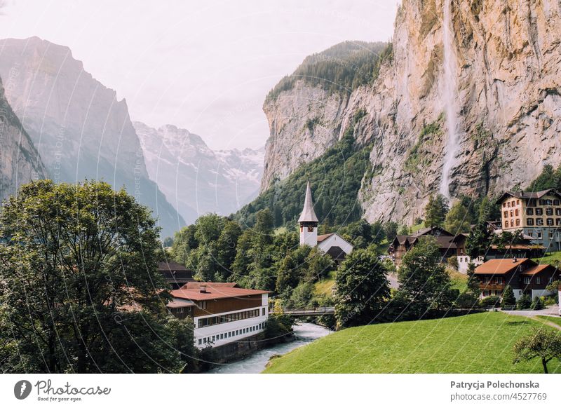 Lauterbrunnen Waterfall and Church View in the Alps in Switzerland Valley Landscape Town Summer