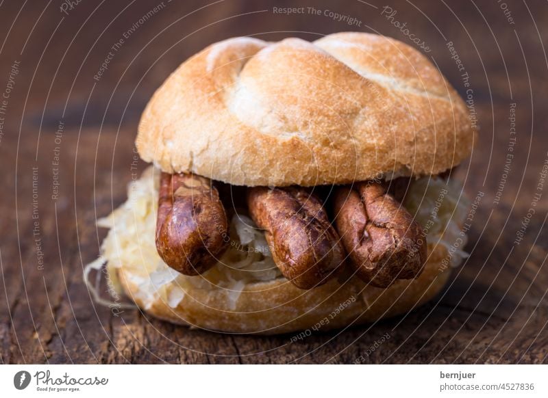 Nuremberger sausages with sauerkraut in a roll Bratwurst Meat Bavaria Eating sandwich Bread Barbecue (apparatus) Small sausage Pork Mustard grilled hot dog Roll