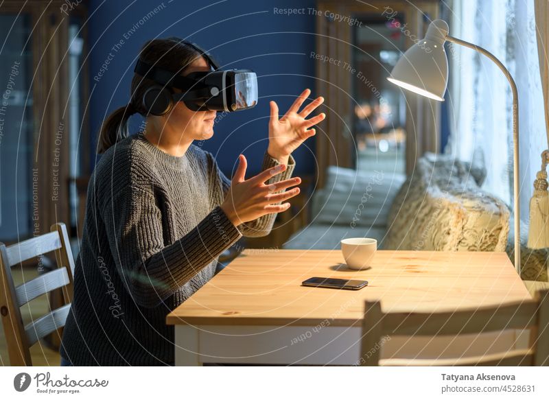 Woman using vr headset at home woman person virtual reality glass technology entertainment businesswoman innovation futuristic device female modern digital