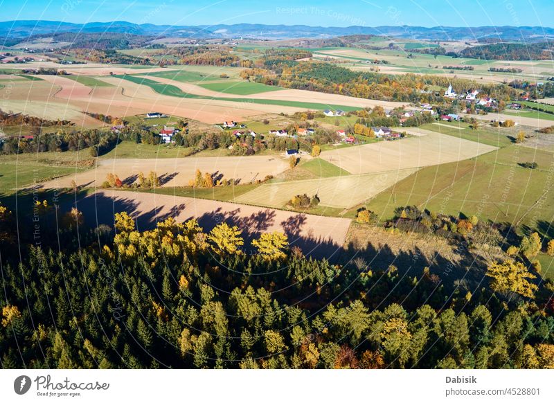 Mountain village and agricultural fields, aerial view. Nature landscape mountain country forest countryside autumn outdoors tree nature travel scenic background