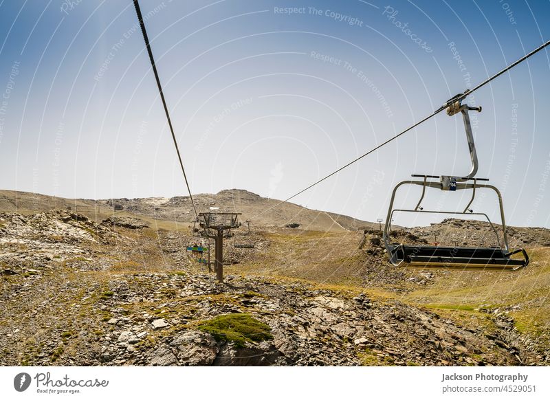 Cable car from ski resort Sierra Nevada through Sierra Nevada National Park, Spain cable car spain sierra nevada mountains landscape copy space