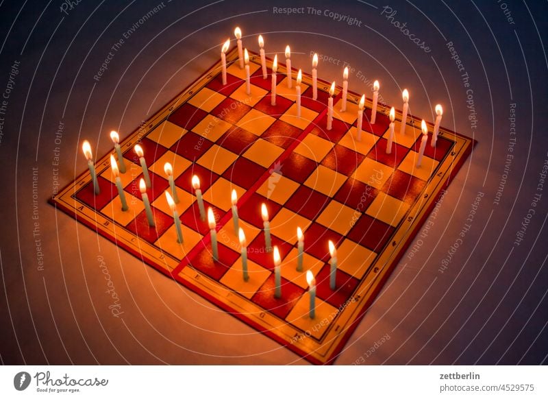 Chess in Advent Blaze Burn Lady checkerboard Dark Fire Bright shoulder stand Illuminate Light Chessboard chessboard game Playing field Move (board game) stearin