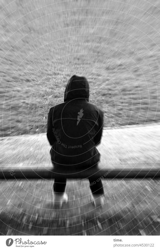 under pressure - back view of a man with hoodie on a park bench Man Bench Jacket Hooded (clothing) Sit Rear view Meadow effect Anorak