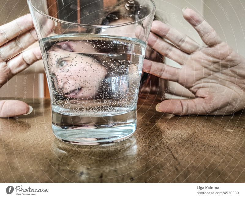 Woman's disorted reflection through water glass Portrait photograph Face Mouth Laughter Joy Happiness Humor Funny Nose