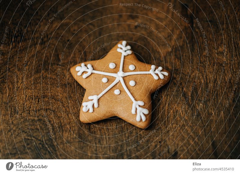 Gingerbread in the shape of a star on wood. Christmas biscuits. Stars star shape Icing Christmas Bakery Wood Christmas & Advent Baking Baked goods