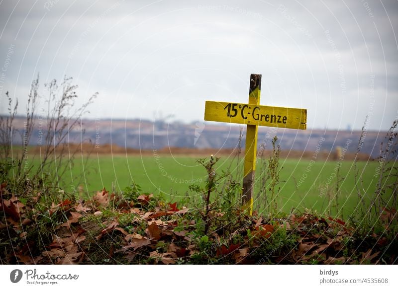 1.5 degrees - border, warning sign at the edge of the opencast lignite mine Garzweiler2 in NRW. All villages stay ! Soft coal mining Global warming coal exit