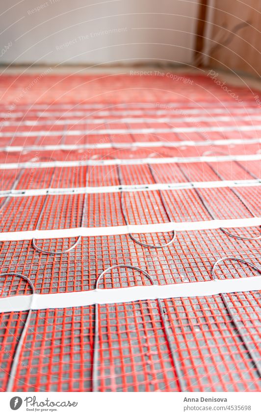 Process of instalation of electric underfloor heating mats installing indoor domestic home house cable installation thermal warm interior room hot grid