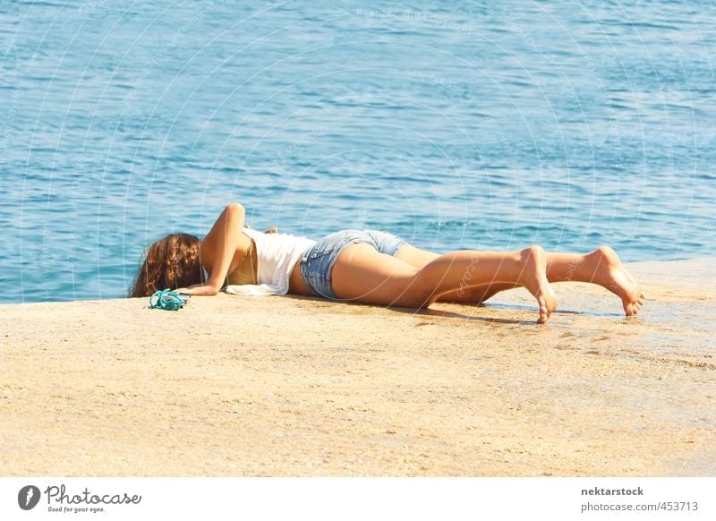 girl at water Vacation & Travel Summer Summer vacation Sun Sunbathing Ocean Feminine Young woman Youth (Young adults) Skin Back Bottom Legs Feet 1 Human being