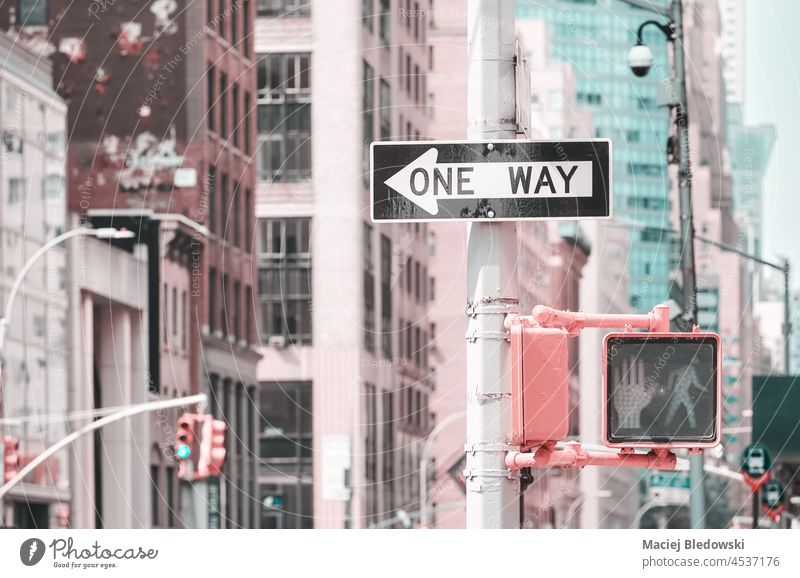 One Way traffic sign, color toning applied, selective focus, New York City, USA. city street arrow direction way retro road sign Manhattan NYC urban America