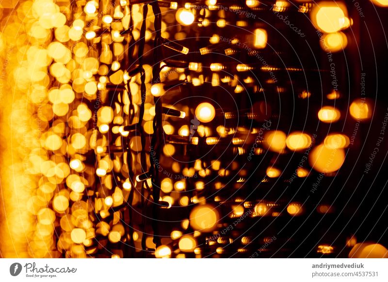 circular bokeh background of Christmaslight. bokeh from garlands. background for screensaver. Defocused lights. Blurred bokeh with yellow color lights. - a Royalty Free Stock Photo from Photocase