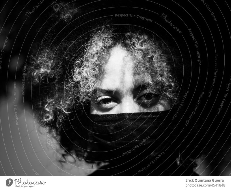 A woman portrait with mask Woman woman with mask Black & white photo black and white Black and white photography afro hair Curly hair Curls big eyes