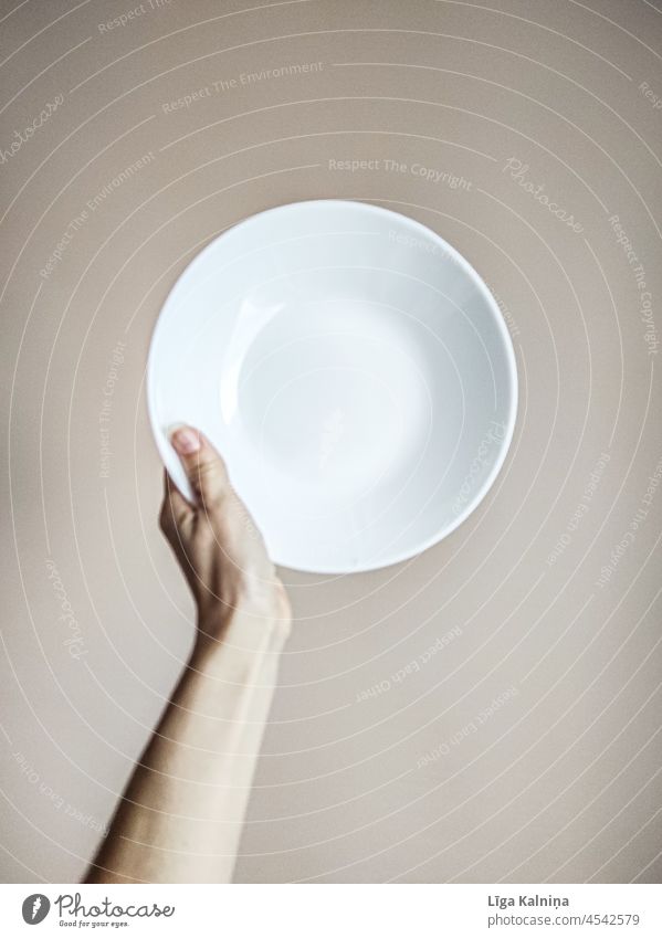 Hand holding a white empty plate Plate Gastronomy Kitchen Dish Cutlery Eating White Empty Minimalistic background utensil minimalism minimalist white background