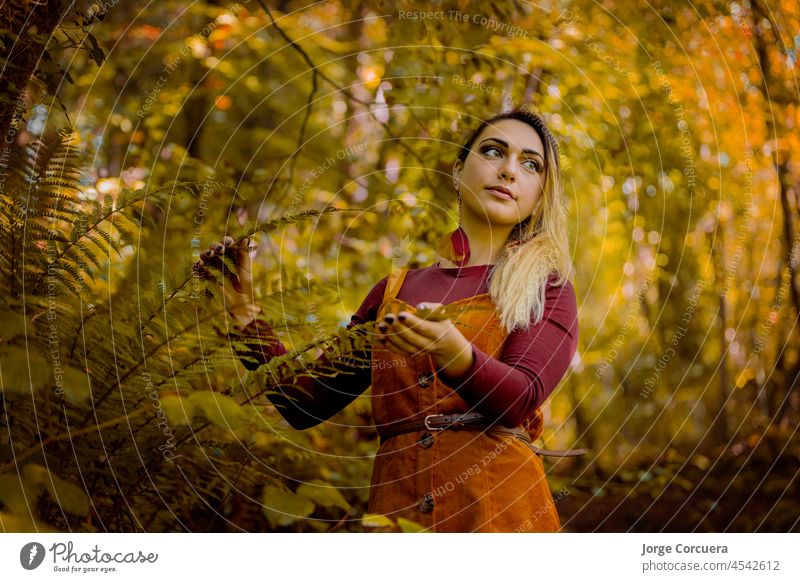 young blonde Caucasian woman in autumn environment, in a forest nature fun summer happy joy meadow vacation childhood holiday smile happiness outdoor cute