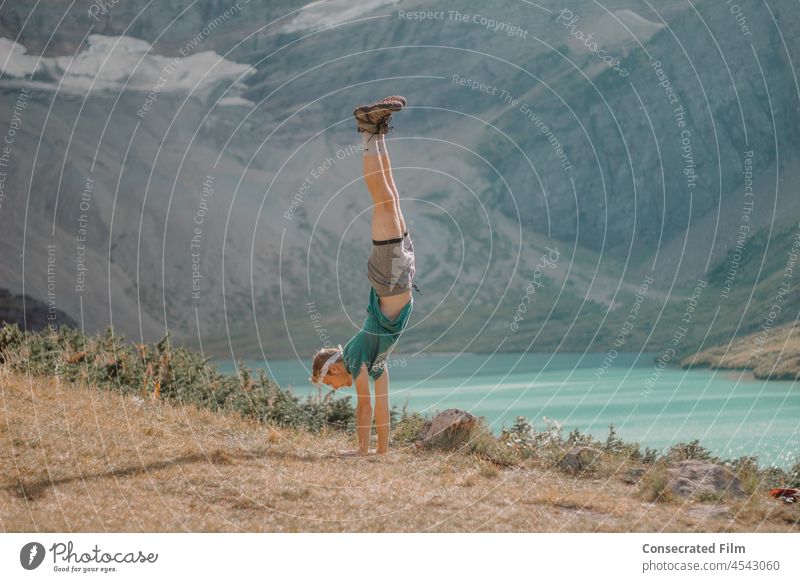 Man doing a handstand in the mountains with beautiful lake in the background Mountains Colorado Montana West outwest Vacation & Travel Colour photo Adventure