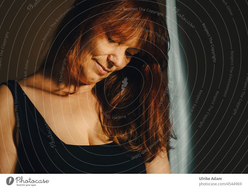 Relaxed pondering | woman with long red hair looks dreamily with her head slightly tilted downwards portrait Adults Human being Yoga erotic Chin Red-haired