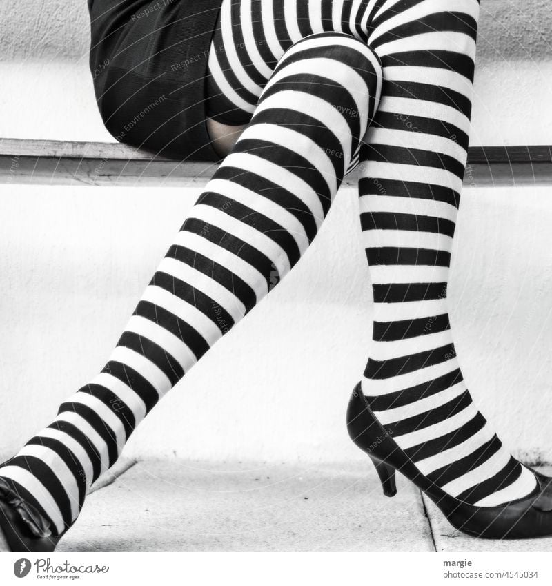 A woman with black and white striped stockings Stockings Legs Tights Woman Human being Clothing Feet High heels Adults Lifestyle feminine Exceptional