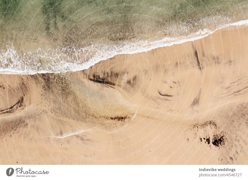 Aerial photo of a sandy beach in Ireland. Keem beach is a small beach in the Achill sound in Ireland. Cristal clear ocean water and natural sand on the shore.