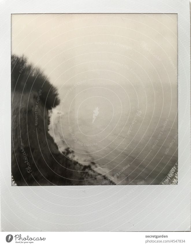 surreal | the other day at the edge of the cliff coast blurred Polaroid Tall Fear of heights Far-off places Horizon Lake Ocean Baltic Sea Black & white photo