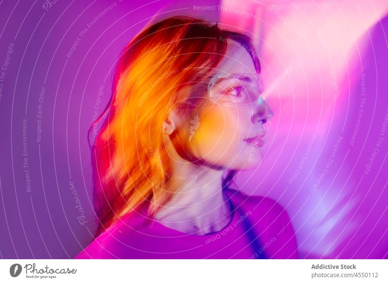 Young Woman With Led Glasses Eyes In Studio videogame creative futuristic virtual reality woman metaverse neon long exposure light colorful illuminate weird
