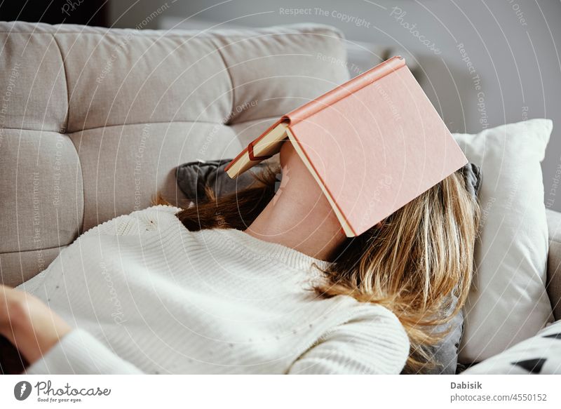 Woman sleeps on couch with book woman reading leisure relax sofa comfort chill lifestyle person female rest day human relaxation comfortable enjoyment home room