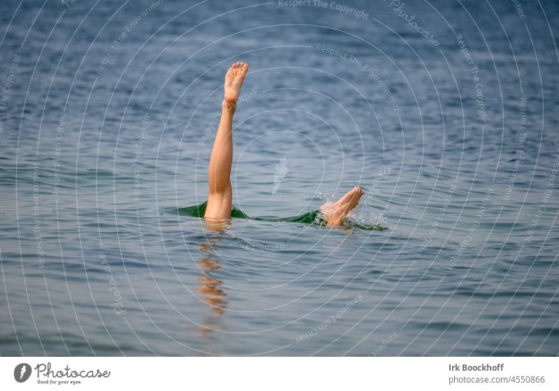 Bathing fun - handstand under water Human being Colour photo Exterior shot Joie de vivre (Vitality) Water Copy Space bottom Copy Space top Happiness Baltic Sea
