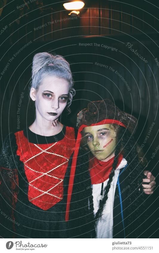 Dracula's daughter and little zombie pirate| Kids dressed up scary for Halloween portrait 2 children Hallowe'en Vampire Zombie Creepy Death Dark Threat Looking