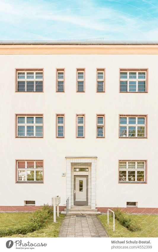 Tenement house from the Bauhaus era in a warm colour scheme House (Residential Structure) Deserted Window Exterior shot Magdeburg Modernity Colour photo