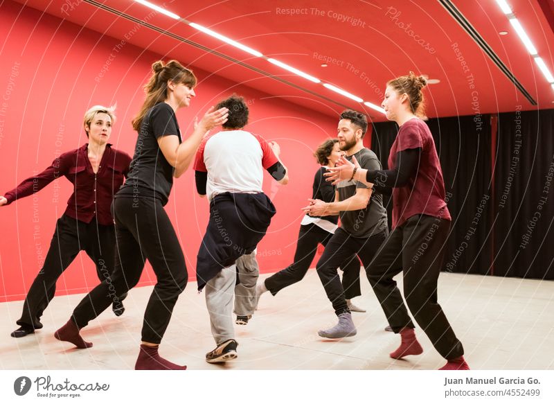 Group of theater students in expression class expressive theatre wellbeing dancer imagination explore sportswear fight wellness learning dream club fit