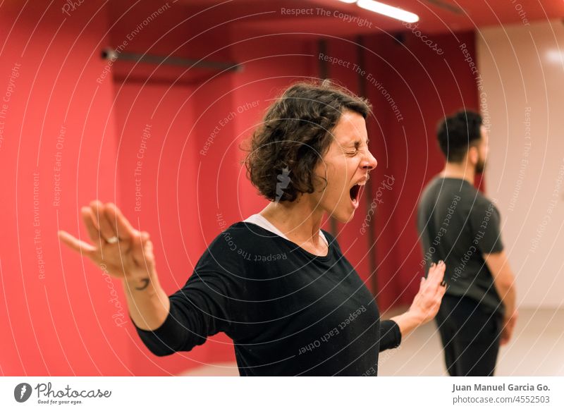Theater student during exercise showing emotion expressive students teach shout theatre teacher wellbeing dancer imagination explore sportswear fight wellness