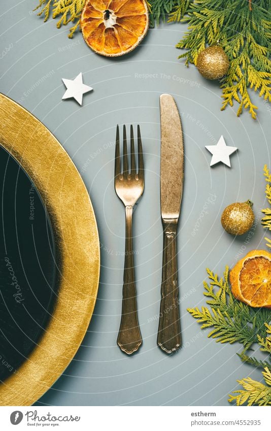 Christmas concept background. Vintage old cutlery, plate for Christmas Dinner and christmas ornament. Christmas dinner concept christmas eve