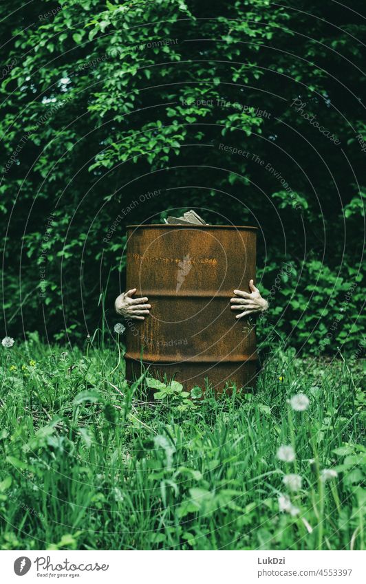 Human hands covering an old rusty barrel in the garden Together Old To hold on Attachment Arms confident Rust Keg manufacturing garbage environmental crude