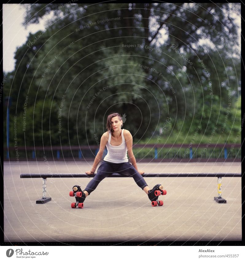 analogue portrait of a young woman with roller skates on a skating rink Joy Rollerskating Roller skates Skater circuit Young woman Youth (Young adults)