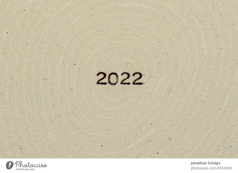 Year 2022 as text on paper with typewriter Year date Paper Recycling Typewriter writing typography number Number 2022 Analog Retro Text Copy Space vintage