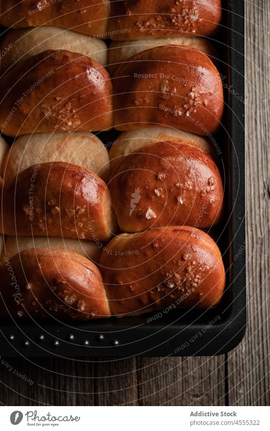 Delicious soft dinner rolls on baking pan baked tasty delicious food bun bread tray cook row snack appetizing prepare palatable yummy nutrition delectable fresh