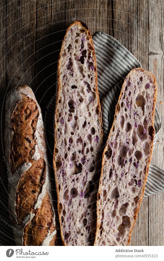 Sourdough baguettes located on table sourdough food baked tasty cut pastry crunch bakery crust pore half homemade cookery whole organic delicious product